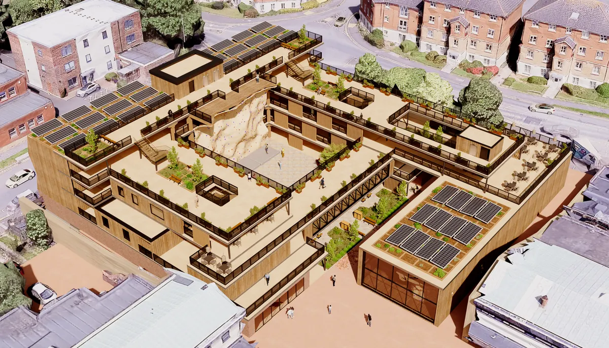 Aerial CGI of a sustainable modular housing block with rooftop gardens and solar panels